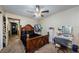 Bright bedroom features a large bed, vanity, and a ceiling fan at 2261 Swedish Dr # 33&35, Clearwater, FL 33763