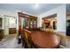 Dining area showcasing a decorative cabinet and comfortable seating with a view into the kitchen at 2261 Swedish Dr # 33&35, Clearwater, FL 33763