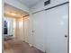 Hallway with carpet and multiple closet doors offers ample storage space at 2261 Swedish Dr # 33&35, Clearwater, FL 33763