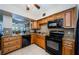 Well-lit kitchen featuring modern appliances, tiled backsplash, and plenty of cabinet storage at 2261 Swedish Dr # 33&35, Clearwater, FL 33763