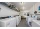 Well lit laundry room featuring multiple coin operated washers and dryers at 2261 Swedish Dr # 33&35, Clearwater, FL 33763