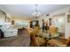 Inviting living room with a glass dining table and a comfortable sectional couch at 2261 Swedish Dr # 33&35, Clearwater, FL 33763
