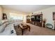 Comfortable living room with a sectional couch and a wooden entertainment center at 2261 Swedish Dr # 33&35, Clearwater, FL 33763
