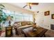 Inviting living room with a large window, cozy sofa, and side tables at 2261 Swedish Dr # 33&35, Clearwater, FL 33763