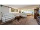 Cozy living room with a large sectional couch and decorative artwork at 2261 Swedish Dr # 33&35, Clearwater, FL 33763