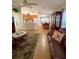 Inviting living space with a view of the kitchen and dining area, perfect for entertaining at 2931 Walnut Grove Ct, Holiday, FL 34691