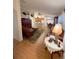 Inviting living room featuring wood floors, comfortable seating, and an open floor plan that flows into the kitchen at 2931 Walnut Grove Ct, Holiday, FL 34691