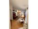 Open-concept living room with a view into the kitchen, dining area, and hallway at 2931 Walnut Grove Ct, Holiday, FL 34691