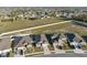 Community view featuring homes with manicured lawns and the added privacy of backyard fences at 3667 Autumn Amber Dr, Spring Hill, FL 34609