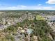Aerial view of neighborhood featuring community amenities, lush greenery, and nearby school at 3667 Autumn Amber Dr, Spring Hill, FL 34609