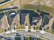 Overhead shot of suburban neighborhood homes with tidy landscaping, orderly driveways, and dark roofs at 3667 Autumn Amber Dr, Spring Hill, FL 34609