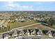 An aerial view of a well-planned community offering modern homes, cul-de-sac streets, and open green spaces at 3667 Autumn Amber Dr, Spring Hill, FL 34609
