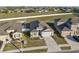 Aerial view of a charming home with a well-manicured lawn in a friendly neighborhood at 3667 Autumn Amber Dr, Spring Hill, FL 34609