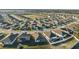 Aerial shot of new residential area, modern homes with patios, and ample backyard space for families and pets at 3667 Autumn Amber Dr, Spring Hill, FL 34609