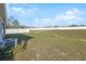 Large backyard space featuring healthy green grass and a white vinyl fence providing seclusion at 3667 Autumn Amber Dr, Spring Hill, FL 34609