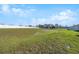 Expansive backyard featuring lush green grass and a sturdy white fence for added privacy at 3667 Autumn Amber Dr, Spring Hill, FL 34609