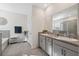 Bright bathroom featuring double sinks with granite counters, a tiled shower, and a separate soaking tub at 3667 Autumn Amber Dr, Spring Hill, FL 34609