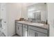 Modern bathroom with double sinks, granite countertops, and a tiled shower offering a luxurious feel at 3667 Autumn Amber Dr, Spring Hill, FL 34609