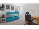 A bedroom with bunk beds, desk, and gaming chair at 3667 Autumn Amber Dr, Spring Hill, FL 34609