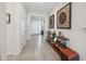 Spacious entryway with tile floors, stylish decor, and an inviting view of the home's interior at 3667 Autumn Amber Dr, Spring Hill, FL 34609