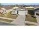 Well-maintained home featuring a beautifully landscaped front yard and a spacious two-car garage at 3667 Autumn Amber Dr, Spring Hill, FL 34609