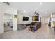 Inviting living room with comfortable seating, tile floors, and an open layout, ideal for entertaining guests at 3667 Autumn Amber Dr, Spring Hill, FL 34609