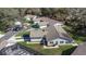 Aerial view of the community with mature trees, pool and well-maintained landscaping at 3806 River Oaks Ct, New Port Richey, FL 34655