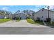 Charming home with a well-manicured lawn and a paved driveway leading to an attached garage at 3806 River Oaks Ct, New Port Richey, FL 34655
