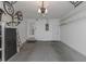 Spacious garage with white walls and overhead storage at 3806 River Oaks Ct, New Port Richey, FL 34655
