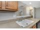 Functional kitchen area featuring a convenient breakfast bar and lots of storage at 3806 River Oaks Ct, New Port Richey, FL 34655