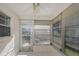 Enclosed patio with tiled flooring, ceiling fan and views to the yard at 3806 River Oaks Ct, New Port Richey, FL 34655