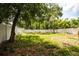 Spacious backyard enclosed by a white fence, offering privacy and ample space for outdoor activities at 4009 N Seminole Ave, Tampa, FL 33603