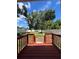 Large backyard with a wooden deck and a white fence at 4009 N Seminole Ave, Tampa, FL 33603