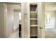 Hallway view of a bathroom and closet leading to a bedroom at 4009 N Seminole Ave, Tampa, FL 33603