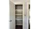 Linen closet with four shelves and gray walls at 4009 N Seminole Ave, Tampa, FL 33603