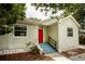 Charming single-story home with a vibrant red front door and inviting curb appeal at 4009 N Seminole Ave, Tampa, FL 33603