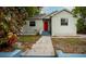 Charming single-story home with a vibrant red front door and inviting curb appeal at 4009 N Seminole Ave, Tampa, FL 33603