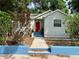 Charming single-story home with a vibrant red front door and a well-maintained walkway at 4009 N Seminole Ave, Tampa, FL 33603