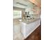 Bright kitchen with granite countertops and updated appliances, perfect for cooking at 4009 N Seminole Ave, Tampa, FL 33603