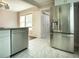 Modern kitchen with stainless steel appliances and stylish marble tile flooring at 4009 N Seminole Ave, Tampa, FL 33603