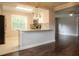 Open concept kitchen with granite countertops seamlessly flowing into the living area at 4009 N Seminole Ave, Tampa, FL 33603