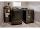 Convenient laundry room with modern washer and dryer units and water heater at 4009 N Seminole Ave, Tampa, FL 33603