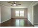 Bright living room with hardwood floors and double windows offering natural light at 4009 N Seminole Ave, Tampa, FL 33603