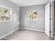 Minimalist bedroom featuring ample natural light and light-colored walls at 406 Zoller St, Brooksville, FL 34601