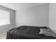 Monochromatic bedroom with natural light at 406 Zoller St, Brooksville, FL 34601