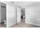 Bright, neutral room with wood-look floors, and white trim at 406 Zoller St, Brooksville, FL 34601