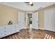 Bedroom with an open doorway, double door closet, and a white dresser at 4206 Candler Ave, Spring Hill, FL 34609