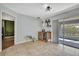 Open floor plan view of dining area with beverage bar and access to a patio at 4206 Candler Ave, Spring Hill, FL 34609