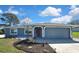 This charming single-story home has a well-maintained lawn, lovely landscaping and a two-car garage at 4206 Candler Ave, Spring Hill, FL 34609