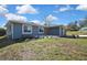Single-story home with a well manicured front lawn and fresh landscaping at 4206 Candler Ave, Spring Hill, FL 34609